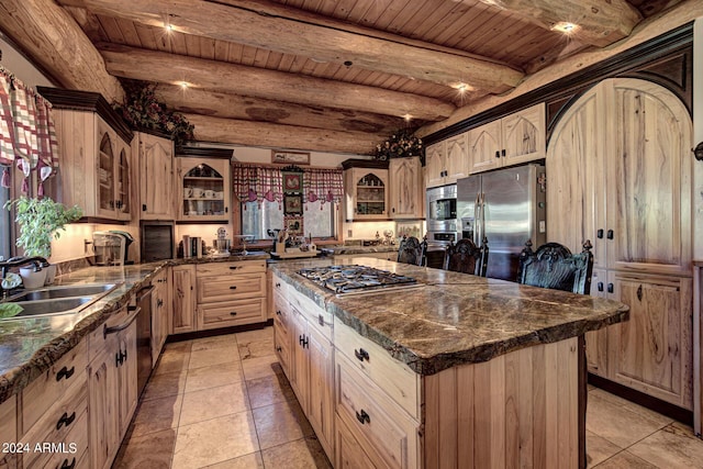 kitchen featuring a sink, stainless steel appliances, beam ceiling, and wooden ceiling