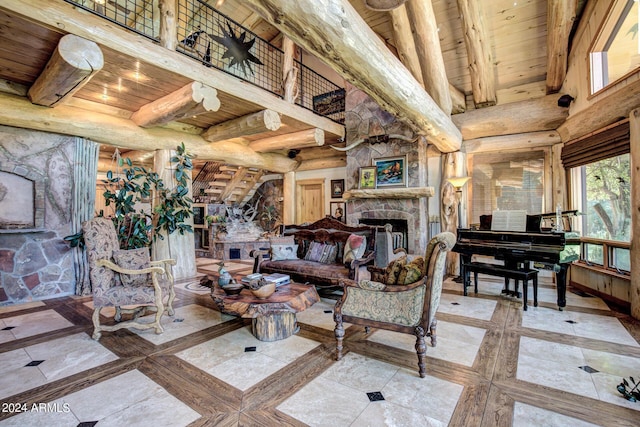 living room featuring beam ceiling, a fireplace, wooden ceiling, and a high ceiling