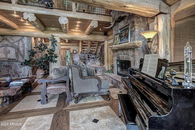 living area with rustic walls, a stone fireplace, beamed ceiling, and wood ceiling