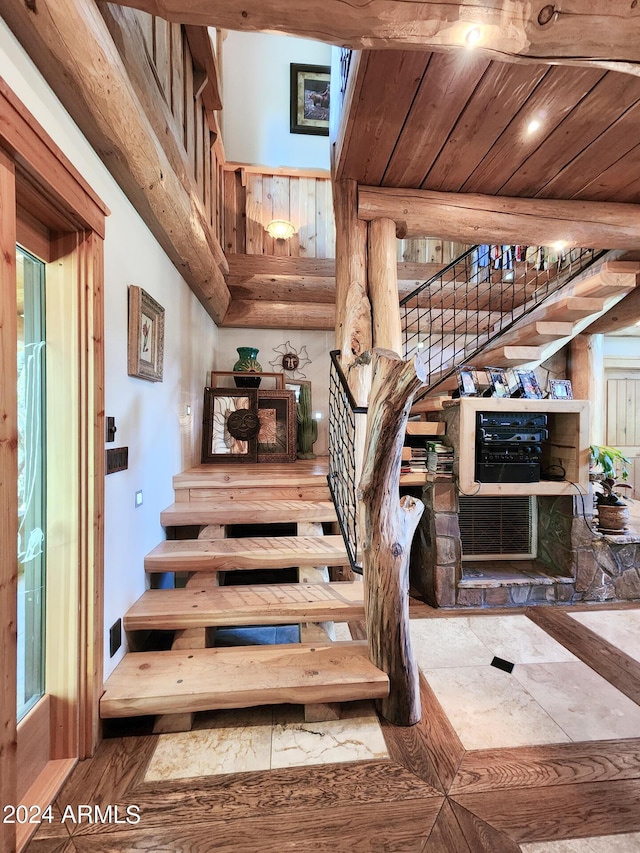 staircase with wooden ceiling