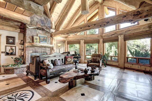 living room featuring beam ceiling, high vaulted ceiling, wooden ceiling, and a fireplace