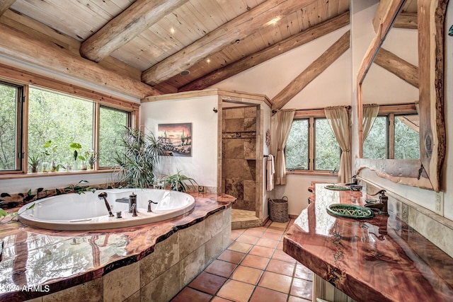 bathroom with tile patterned floors, a tile shower, wood ceiling, a bath, and vaulted ceiling with beams