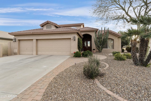 mediterranean / spanish-style home featuring a garage