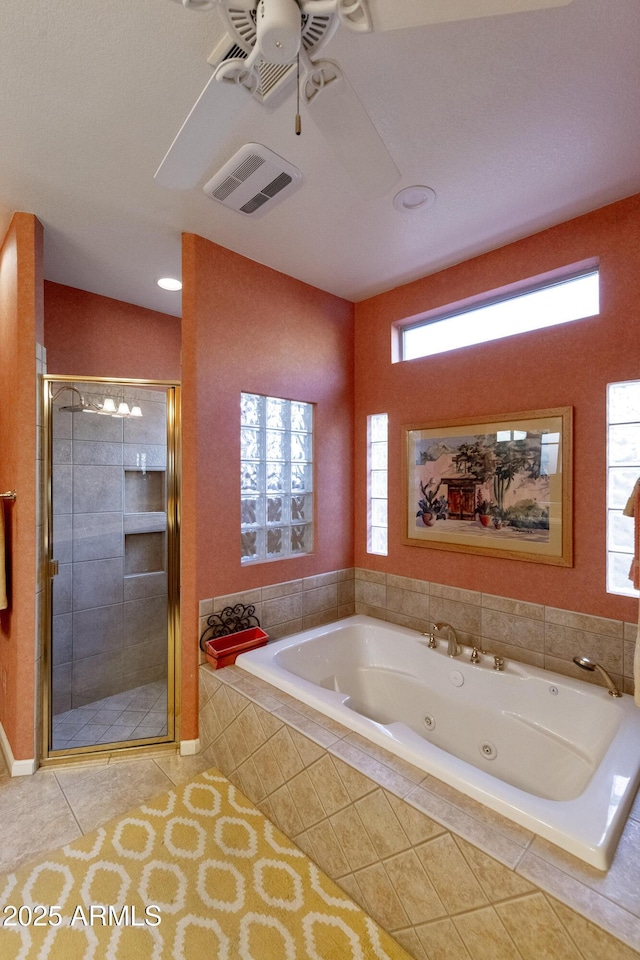 bathroom featuring tile patterned flooring, vaulted ceiling, shower with separate bathtub, and ceiling fan