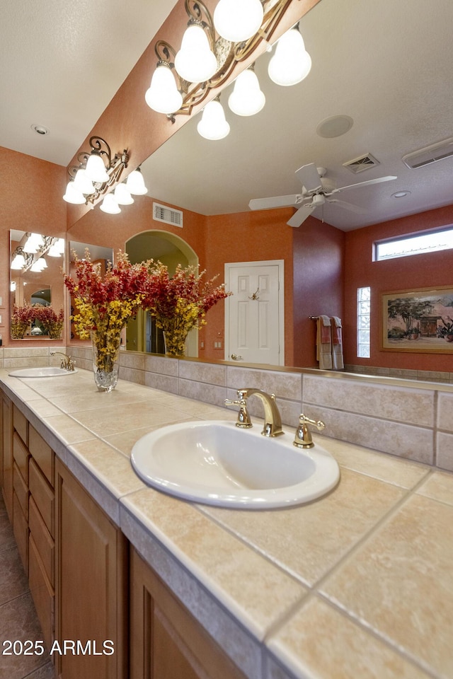 bathroom featuring vanity and ceiling fan