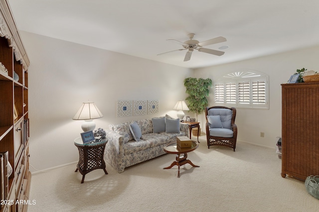 living room featuring light colored carpet and ceiling fan