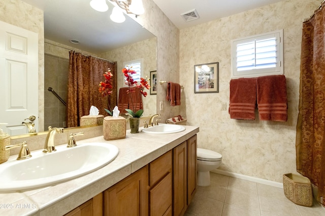 bathroom with vanity, tile patterned floors, and toilet