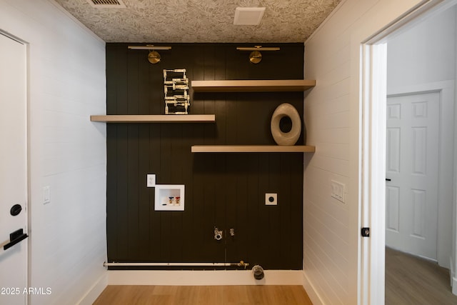 802 N Lisbon Dr, Chandler, AZ 85226 - washroom featuring hookup for a washing machine, wood finished floors, hookup for an electric dryer, wood walls, and hookup for a gas dryer