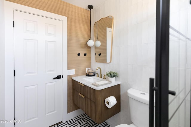 802 N Lisbon Dr, Chandler, AZ 85226 - half bathroom featuring vanity, toilet, and tile walls