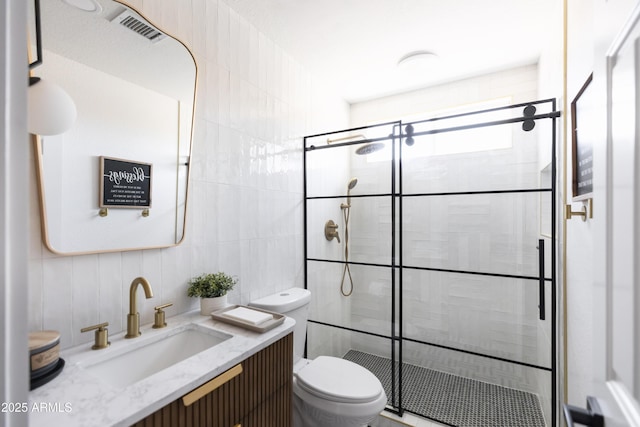 802 N Lisbon Dr, Chandler, AZ 85226 - bathroom featuring tile walls, toilet, a stall shower, and vanity