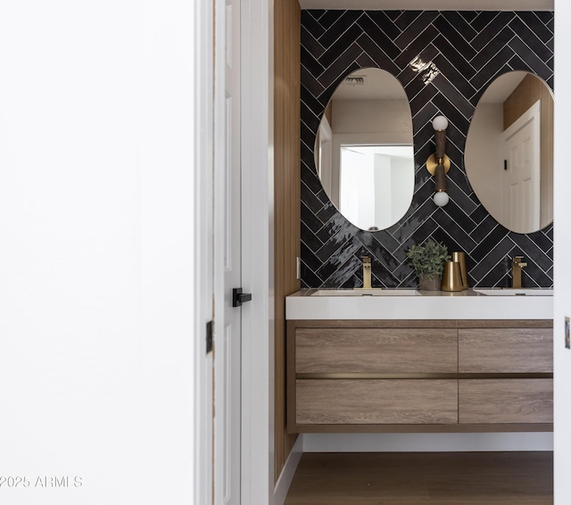 802 N Lisbon Dr, Chandler, AZ 85226 - bathroom featuring vanity and tasteful backsplash