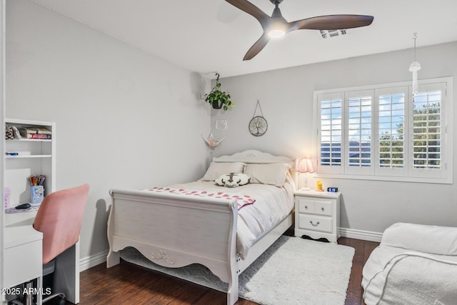 bedroom with baseboards, dark wood-style flooring, ceiling fan, and visible vents