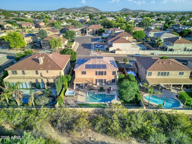 drone / aerial view featuring a mountain view and a residential view
