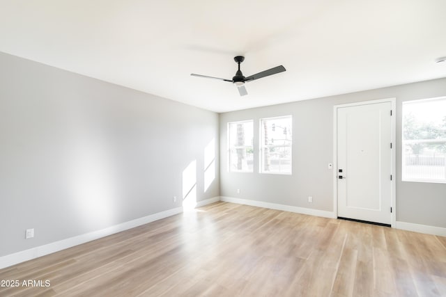 spare room with light hardwood / wood-style flooring and ceiling fan