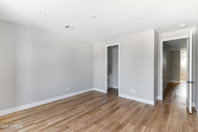 unfurnished room with light hardwood / wood-style flooring