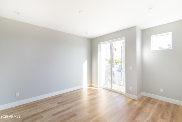 empty room with light hardwood / wood-style floors