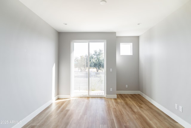 spare room featuring light hardwood / wood-style flooring