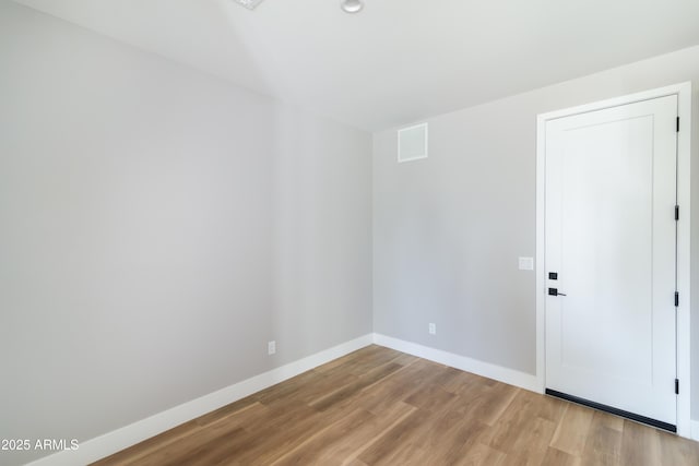 spare room with light wood-type flooring