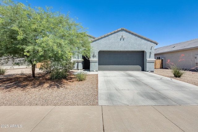 1718 W Cameron Blvd, Coolidge, AZ 85128 - view of front of home with a garage, driveway, stucco siding, and a tile roof