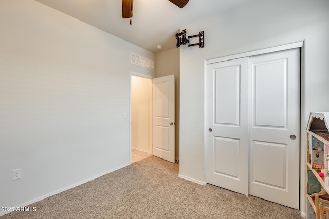 1718 W Cameron Blvd, Coolidge, AZ 85128 - unfurnished bedroom featuring light carpet, a closet, baseboards, and a ceiling fan