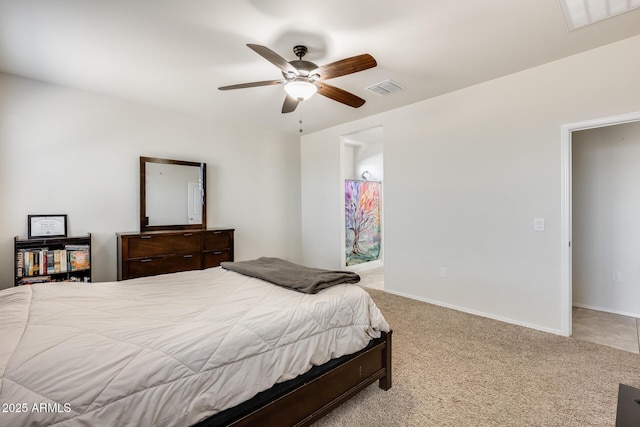 1718 W Cameron Blvd, Coolidge, AZ 85128 - carpeted bedroom featuring baseboards, ceiling fan, and ensuite bathroom