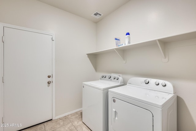 1718 W Cameron Blvd, Coolidge, AZ 85128 - laundry area with washing machine and dryer, baseboards, and light tile patterned floors