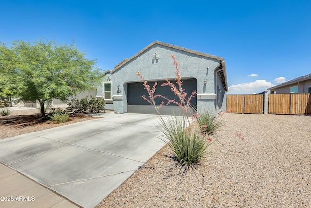 1718 W Cameron Blvd, Coolidge, AZ 85128 - mediterranean / spanish home featuring an attached garage, driveway, and stucco siding