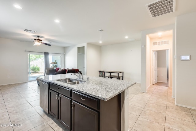 1718 W Cameron Blvd, Coolidge, AZ 85128 - kitchen featuring a sink, dishwasher, ceiling fan, light tile patterned floors, and open floor plan