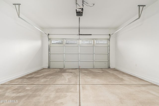 garage featuring baseboards and a garage door opener