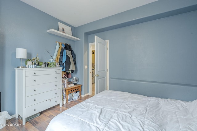 bedroom with wood finished floors