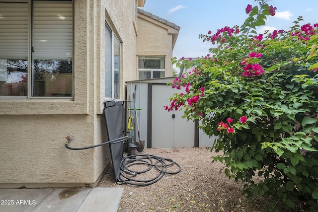 view of side of property with stucco siding