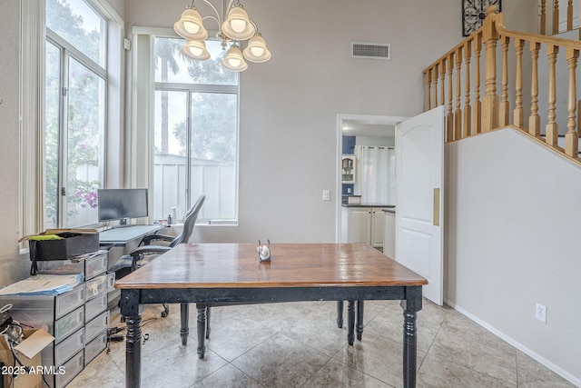 office with a chandelier and baseboards