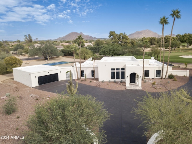 view of front of home featuring a garage and a mountain view