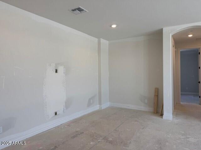 10039 W Verde Ln, Avondale, AZ 85392 - spare room with recessed lighting, visible vents, arched walkways, and baseboards