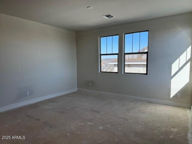 10039 W Verde Ln, Avondale, AZ 85392 - spare room with visible vents and baseboards
