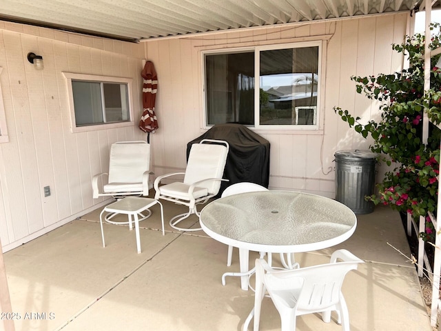 view of patio / terrace featuring outdoor dining area and a grill