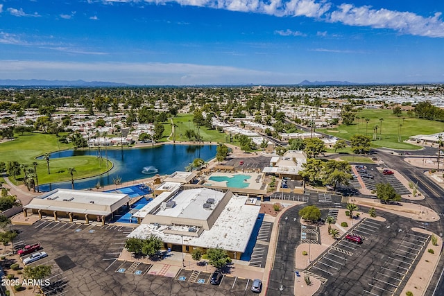 bird's eye view with view of golf course and a water view