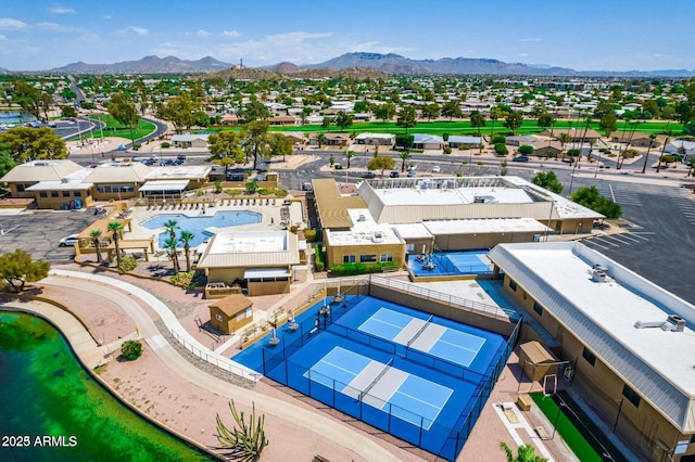 birds eye view of property with a mountain view