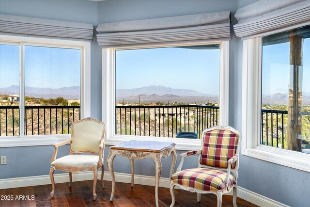 sunroom / solarium with a mountain view