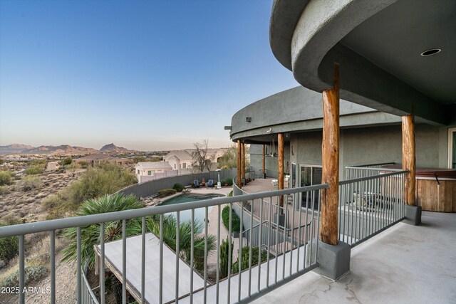 balcony with a patio area and a mountain view