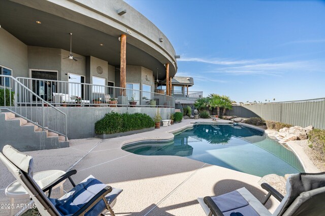 view of pool featuring a fenced in pool, a fenced backyard, ceiling fan, stairway, and a patio area