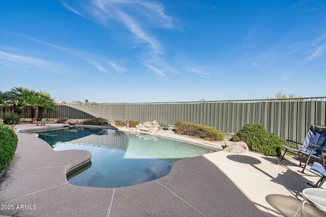 view of pool featuring a fenced in pool, a patio area, and a fenced backyard