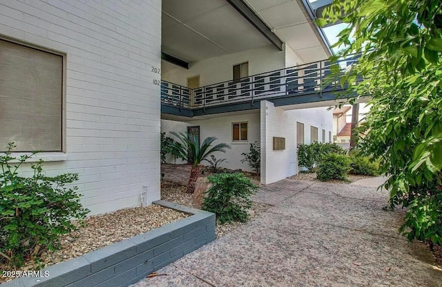 doorway to property with a balcony