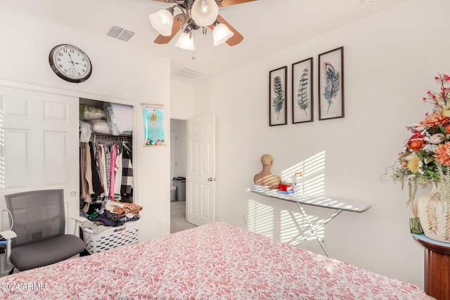 carpeted bedroom featuring ceiling fan and a closet