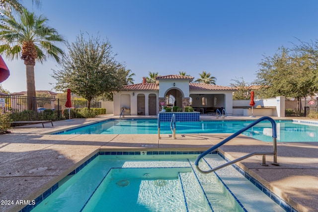 view of swimming pool with a patio