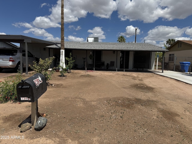 single story home featuring fence