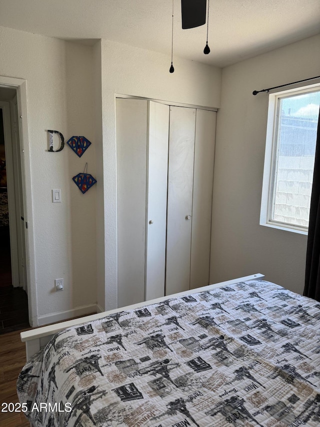 bedroom with a closet and wood finished floors