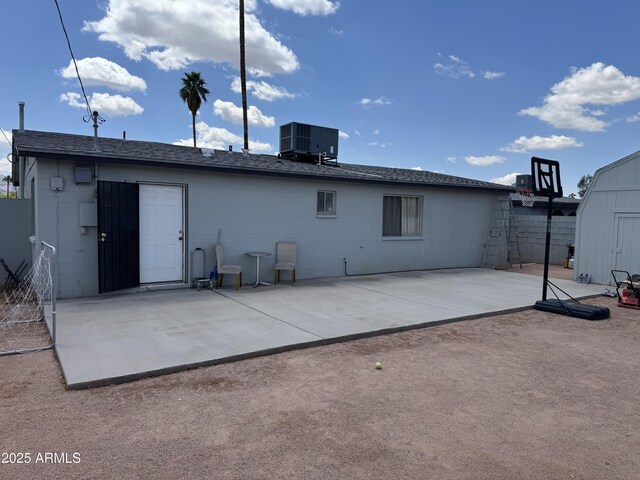 2302 E Sheraton Ln, Phoenix, AZ 85040 - rear view of property featuring a patio, brick siding, and a shed