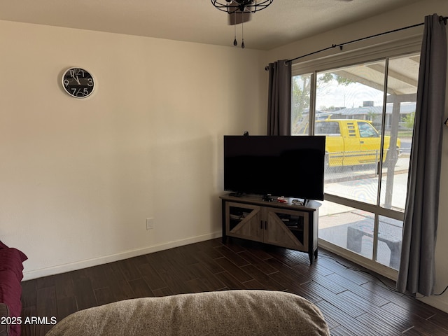 living area with wood tiled floor and baseboards