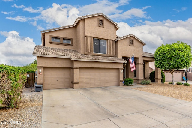 6971 W El Cortez Pl, Peoria, AZ 85383 - view of front facade featuring an attached garage, stucco siding, a tile roof, and concrete driveway